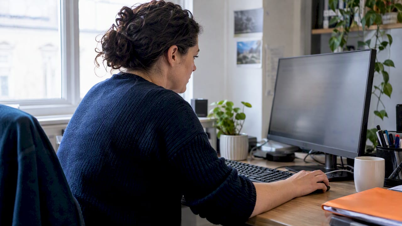 Small business owner reviewing a CRM report